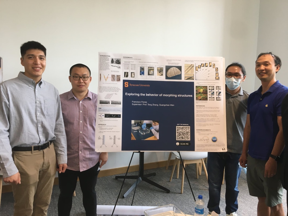 Francisco Flores presents his LSAMP summer research poster, August 2022. From left: Francisco, Guangchao Wan, Gabriel Alkuino, and Prof. Zhang.
